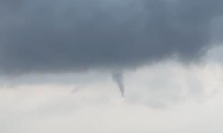 A funnel cloud forms over Niverville.