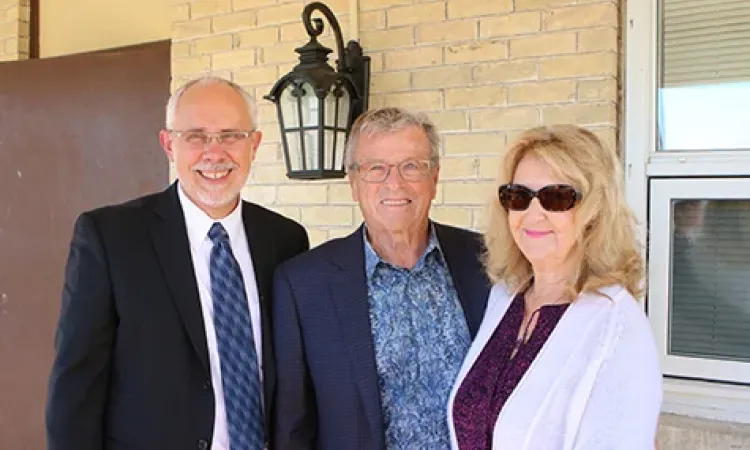 Dr. David Johnson alongside Herb and Erna Buller