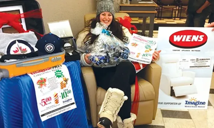 Raffle winner Mel Bergen arrives to claim her prizes