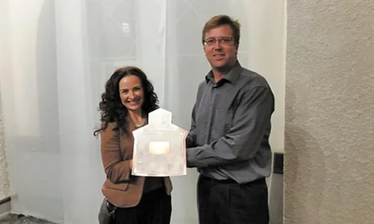 Colleen Dyck receives Business of the Year award from Chamber Director Andy Anderson