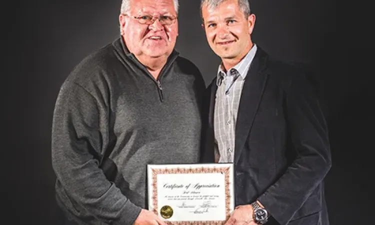Ferd Klassen receiving certificate of appreciation at Fire/EMS appreciation night in May 2015