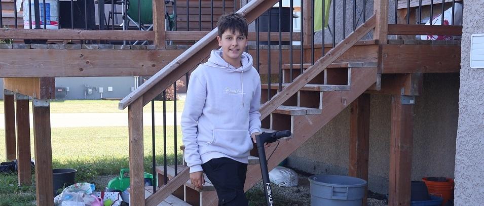Chris Shvets, a 13-year-old e-scooter user from Niverville.