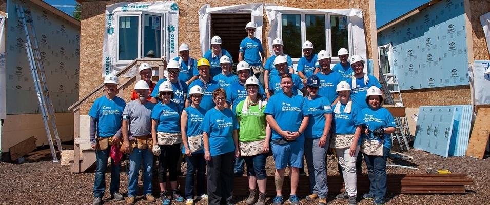 RRG team members along with volunteers at a Habitat home build.