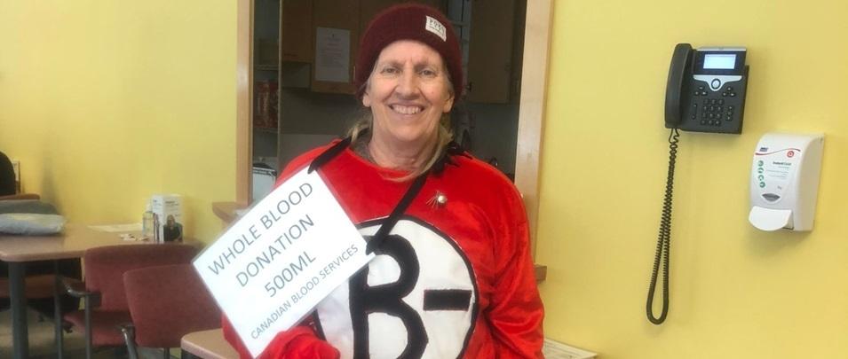 Holly Rafferty makes her one hundredth blood donation at Canadian Blood Services.
