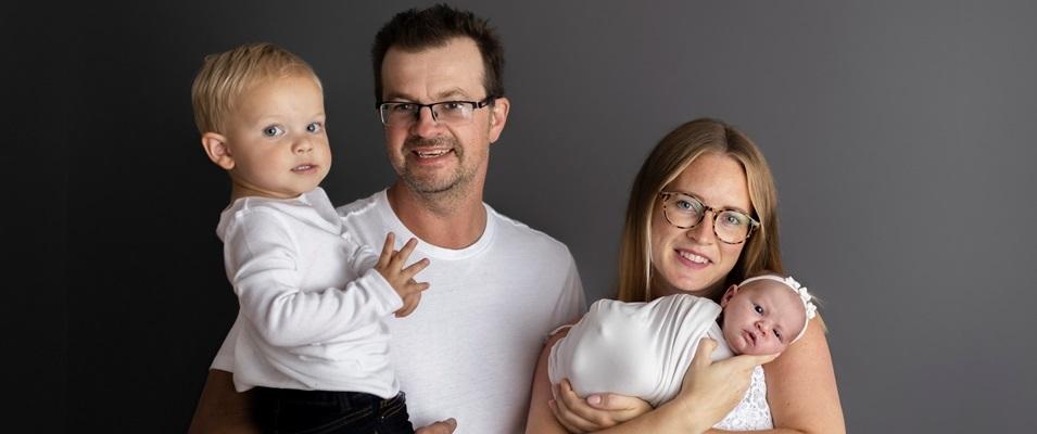 Joel and Raesha Enns with their two children.