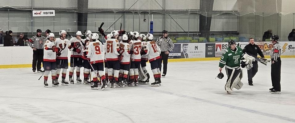 The Nighthawks celebrate their shootout victory against the Portage Terriers.
