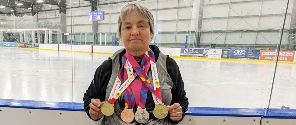 Terrylinn Johnson shows off her most recent medals.