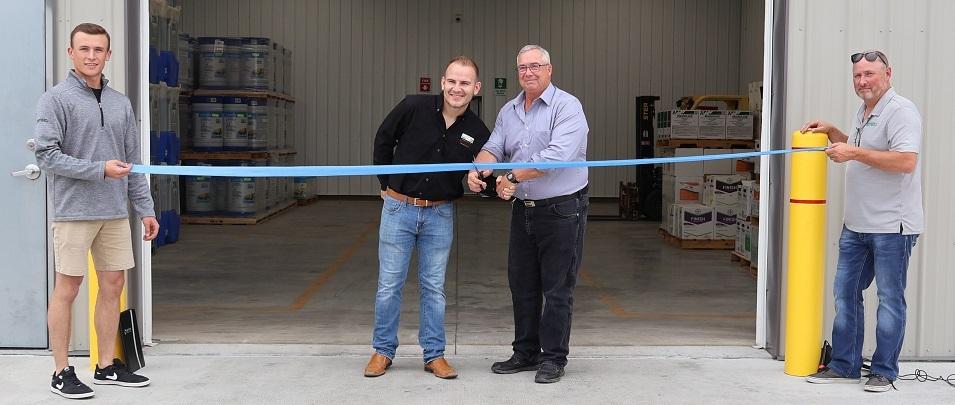 Mayor Chris Ewen cuts the ribbon with Terraco manager Marc Davy.