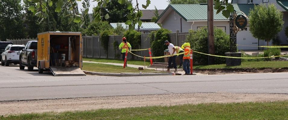 Sidewalk work is underway along Fifth Avenue in preparation for the installation of new crosswalks.