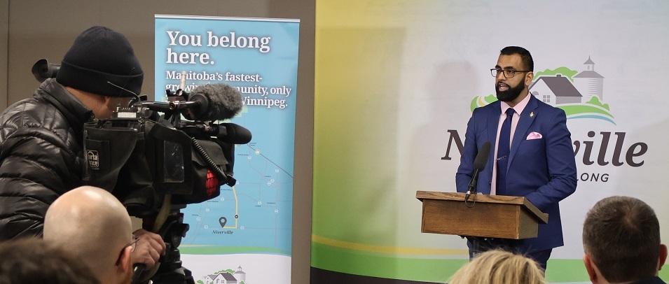 Obby Khan, Minister of Sport, Culture and Heritage, speaks at Niverville press conference.