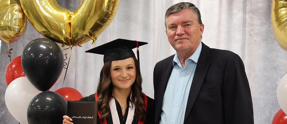 Mayor Myron Dyck with Town of Niverville Award recipient Taylor Sakwi.
