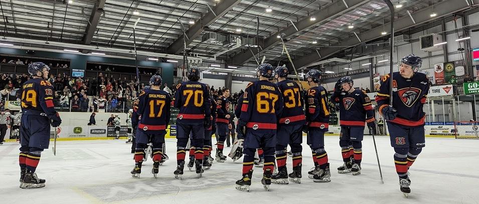After their game five elimination in Portage, the Nighthawks raise their sticks at centre ice.