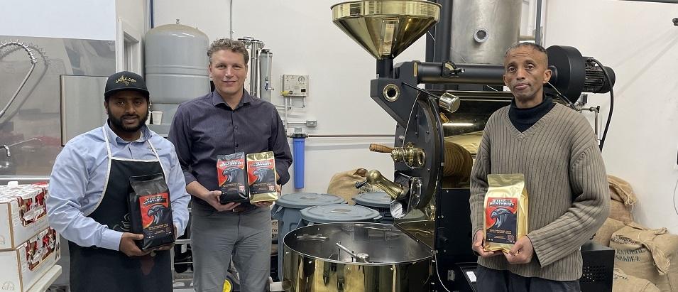 Henok Gebre, Ray Dowse, and Adam Hashi with the new Nighthawks-branded coffee.
