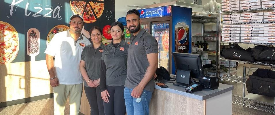 Owners Varinder and Mandeep Ghuman, with new franchisees Prabhleen Saini and Jonty Vashisht.