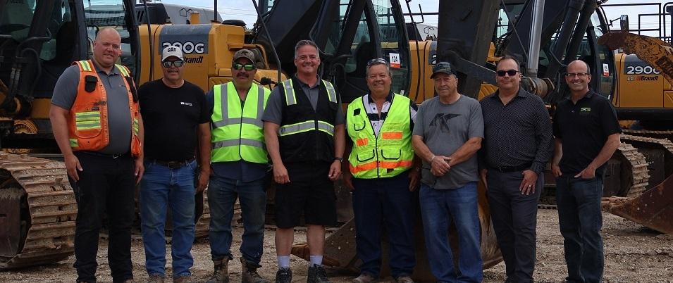 Ritchot councillors, Baudry brothers, and Ritchie Bros. employees at the Ste. Agathe site.