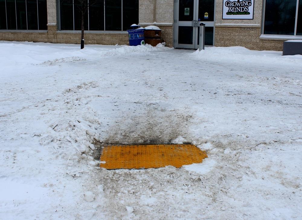 The tacile pads in front of the CRRC in Niverville. (Understandably, the pads are under a lot of snow these days...)