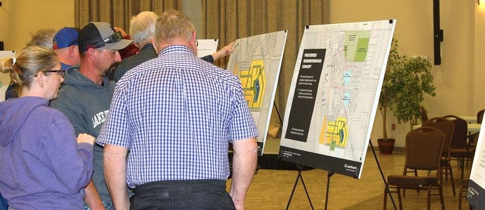 Residents look over plans for new development in Île-des-Chênes.