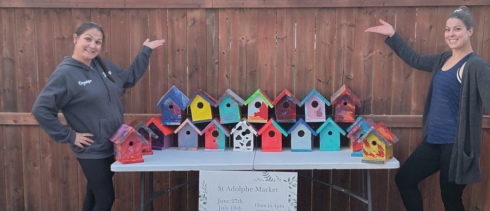 Donna Moroz and Kira Bodnarchuk showcase the new birdhouses destined for the Friendship Trail.