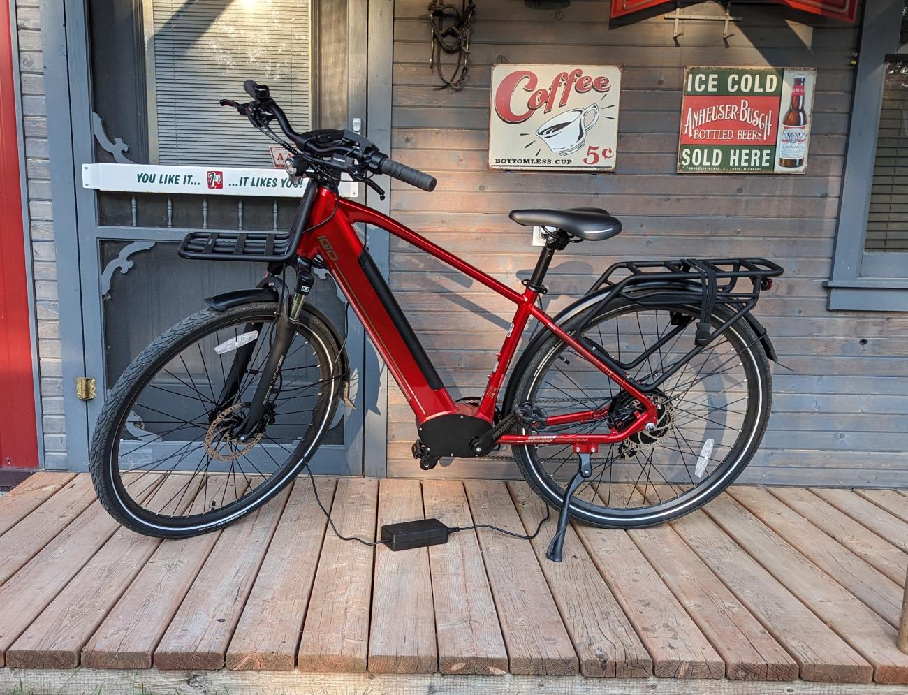 An e-bike attached to its charger.
