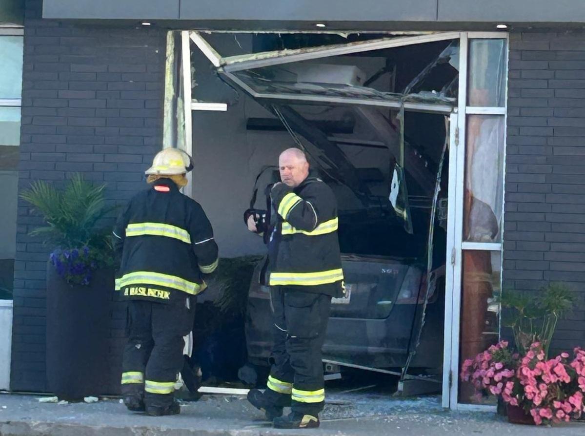 A vehicle has crashed into the front doors of Negash Coffee.