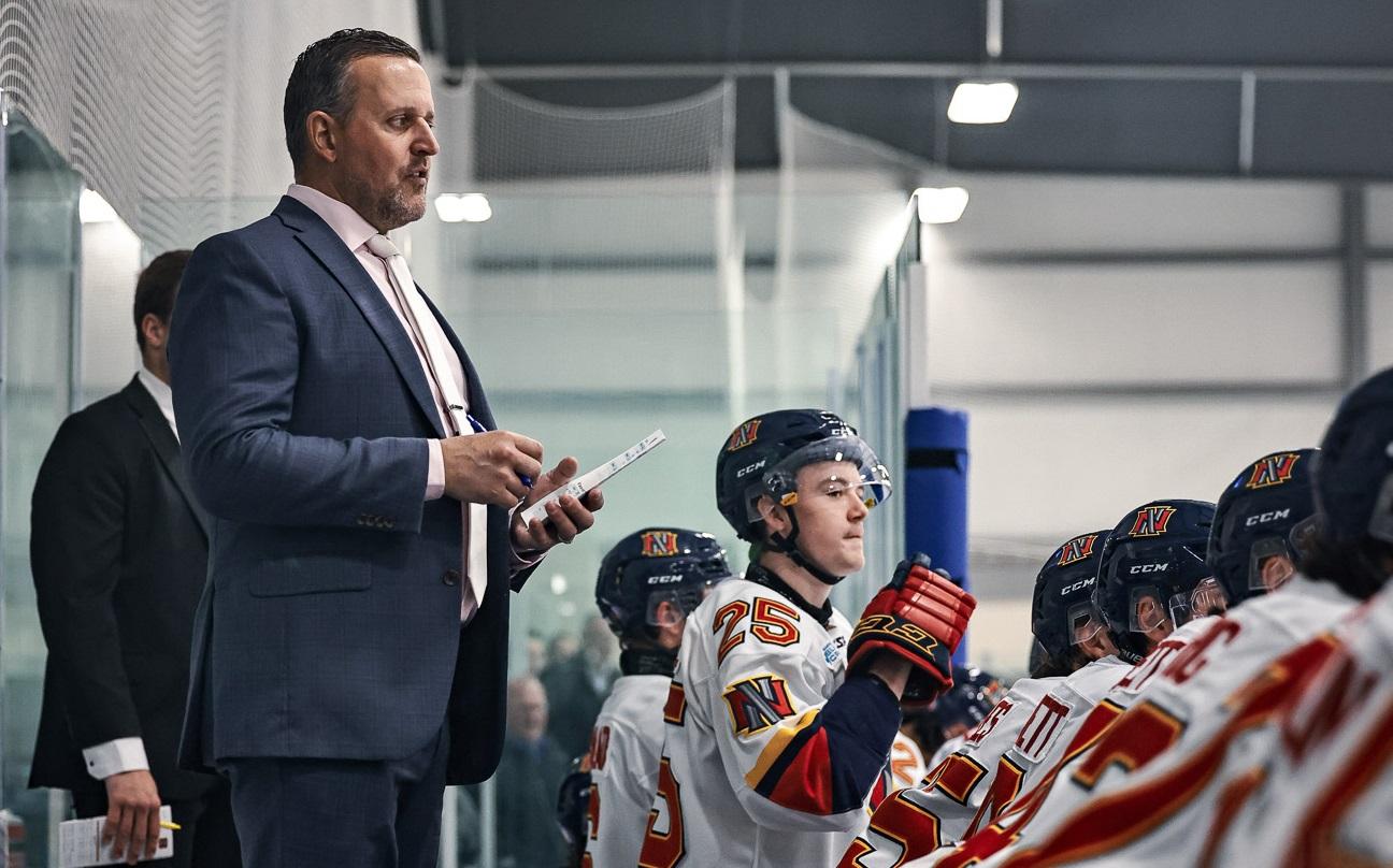 Nighthawks head coach Dwight Hirst behind the bench.